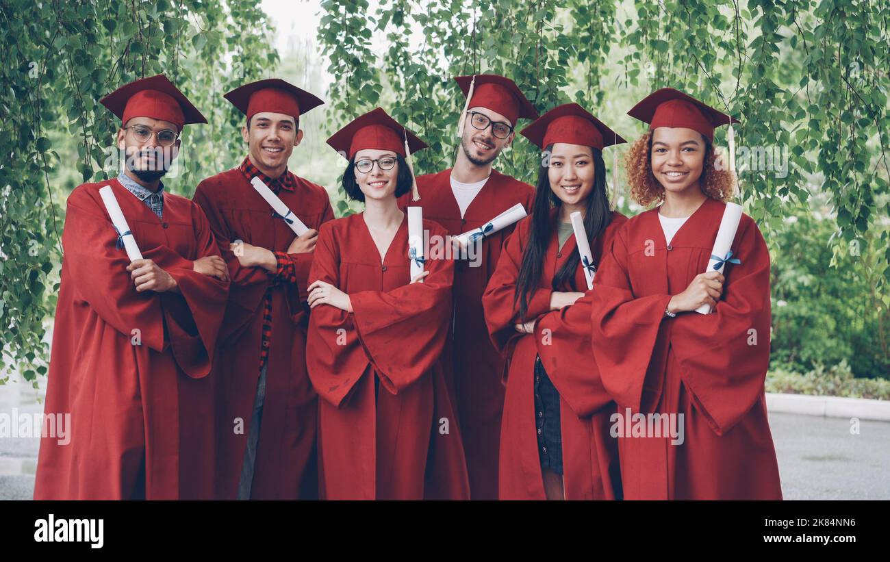 Portrait group students wearing graduation hires stock photography and