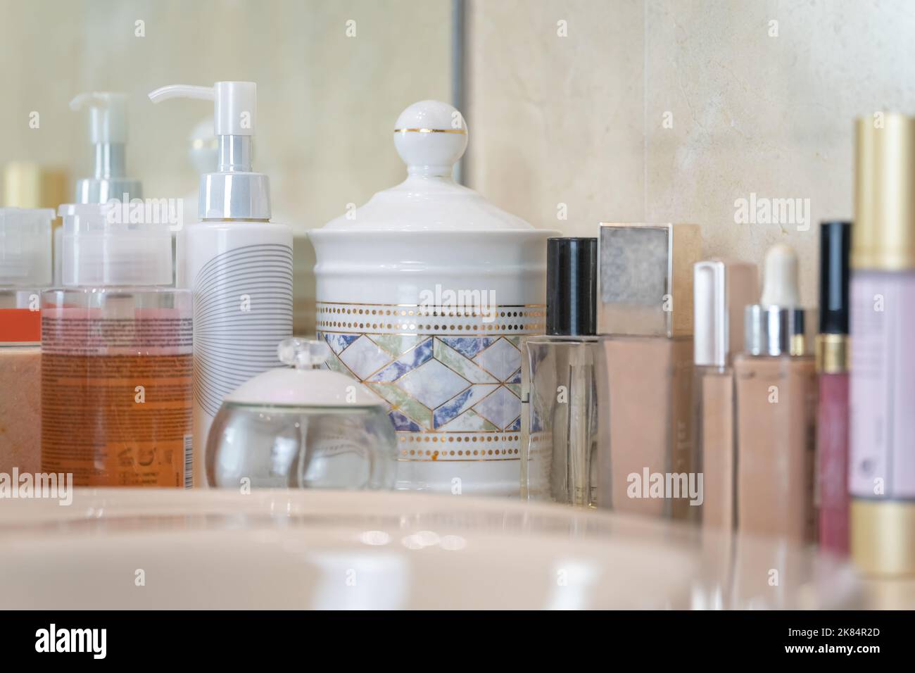 Set of skin care products, exposed on a bathroom shelf. Stock Photo