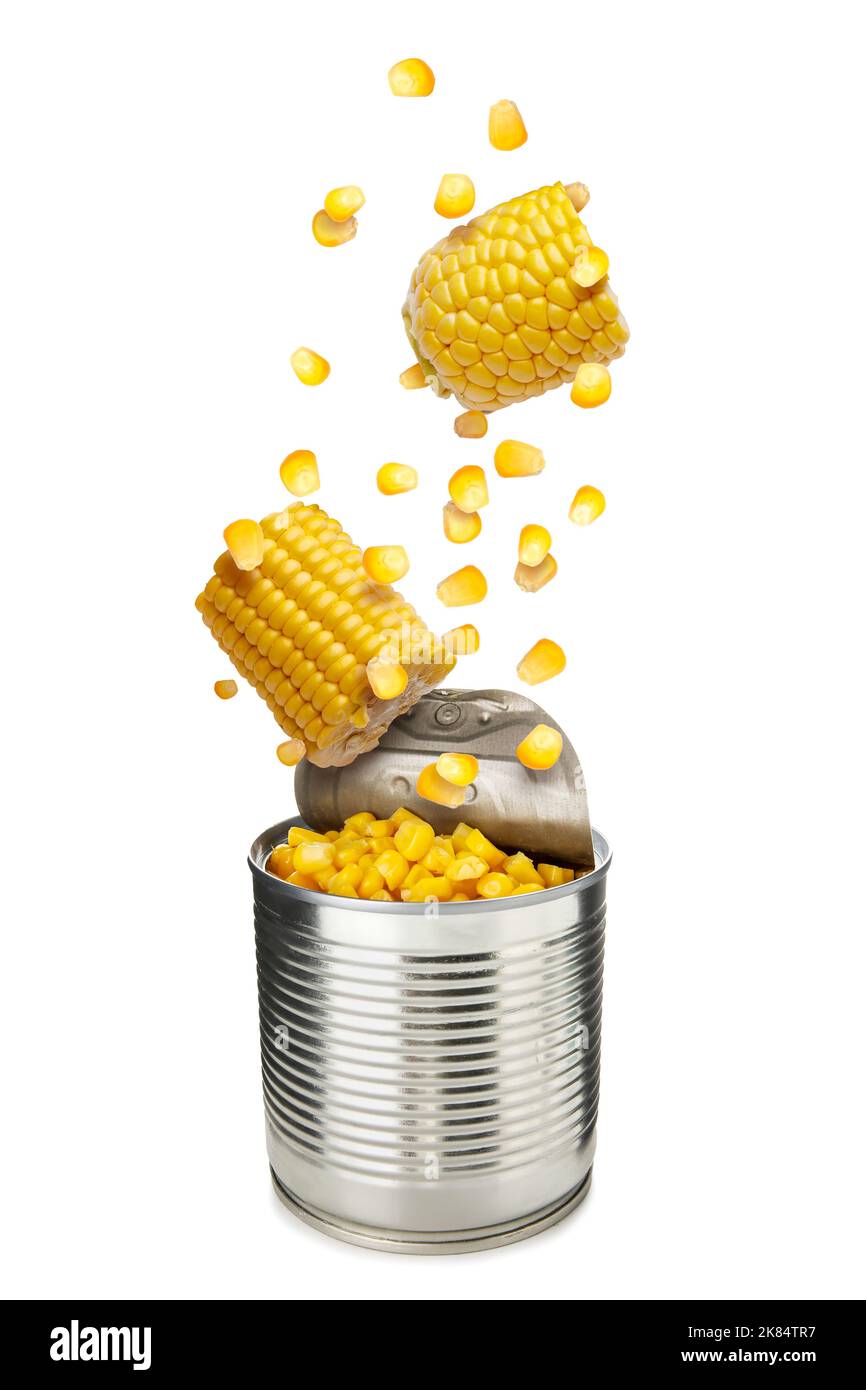 Open tin can with falling tasty corn on white background Stock Photo