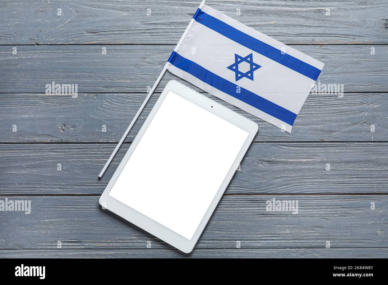 Flag of Israel and text SHABBAT SHALOM on wooden background Stock Photo