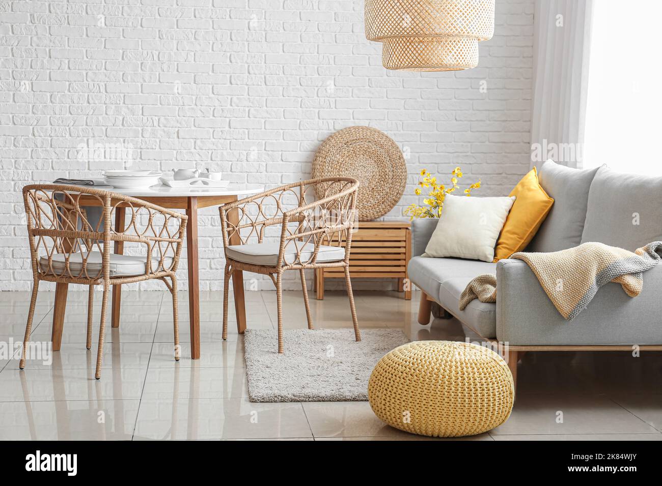 Interior of living room with comfortable sofa and dining table near ...