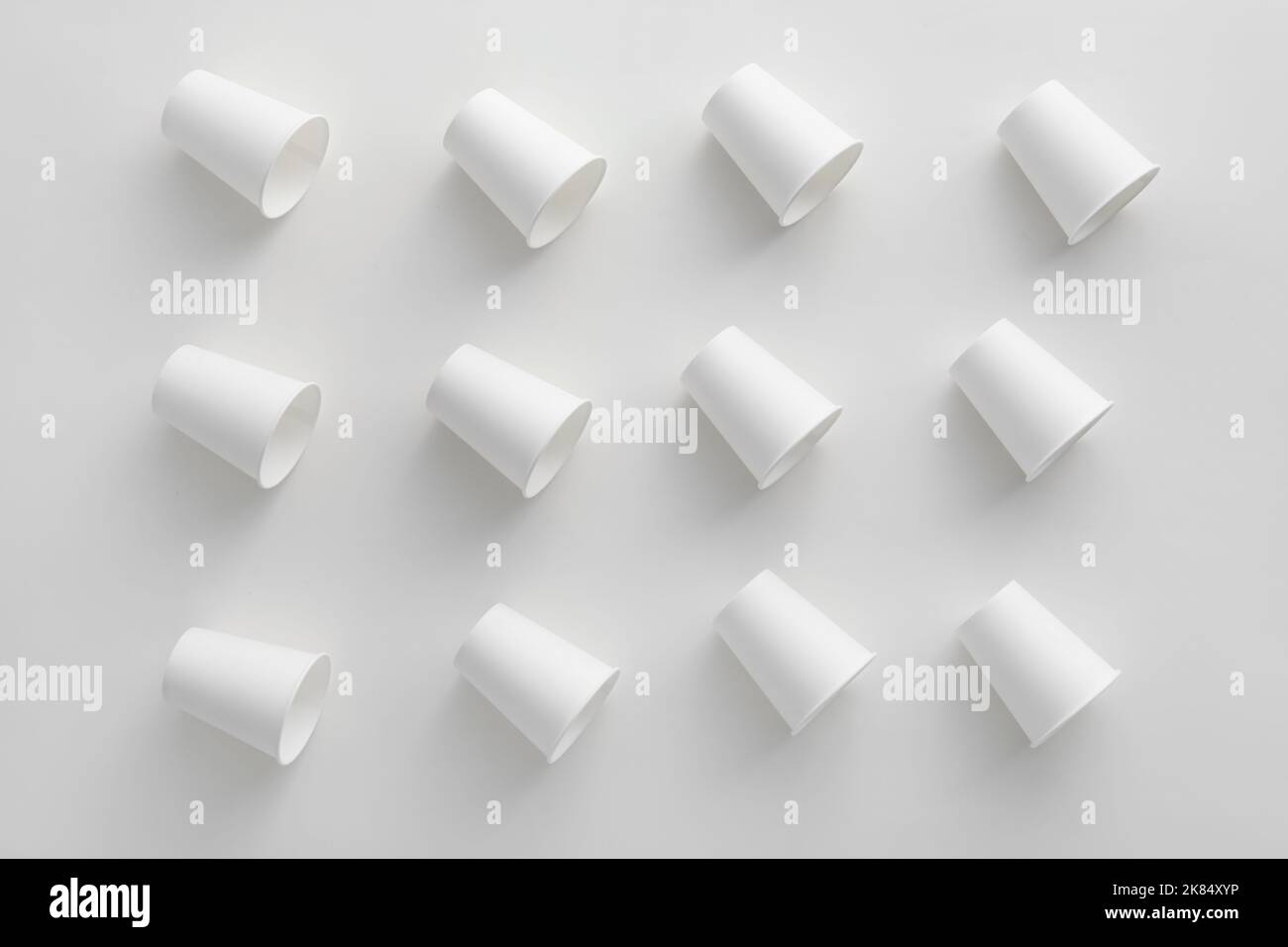 Pattern made of paper cups on white background Stock Photo