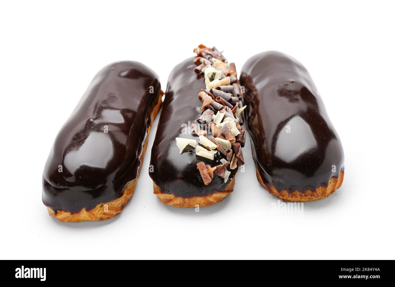 Delicious eclairs in chocolate glaze on white background Stock Photo