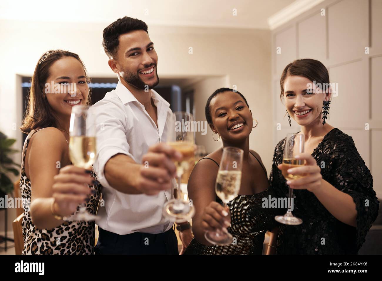 Have a drink with us. a diverse group of friends standing together and