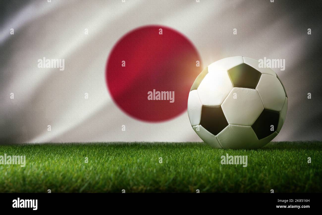Japan national team composition with classic ball on grass and flag in the background. Front view. Stock Photo