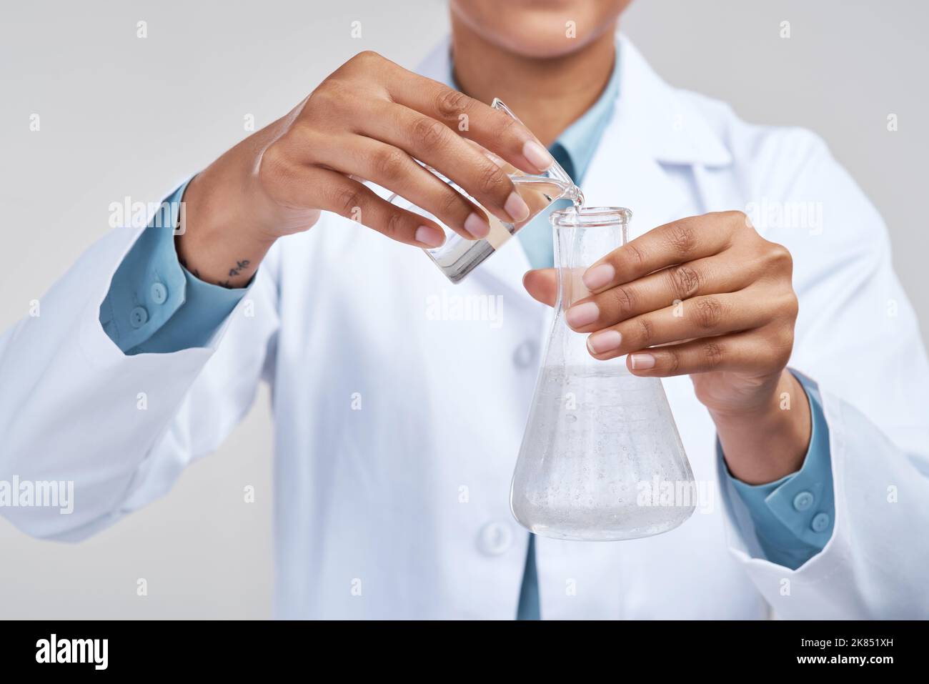 You have to mix solutions carefully. an unrecognizable female scientist ...