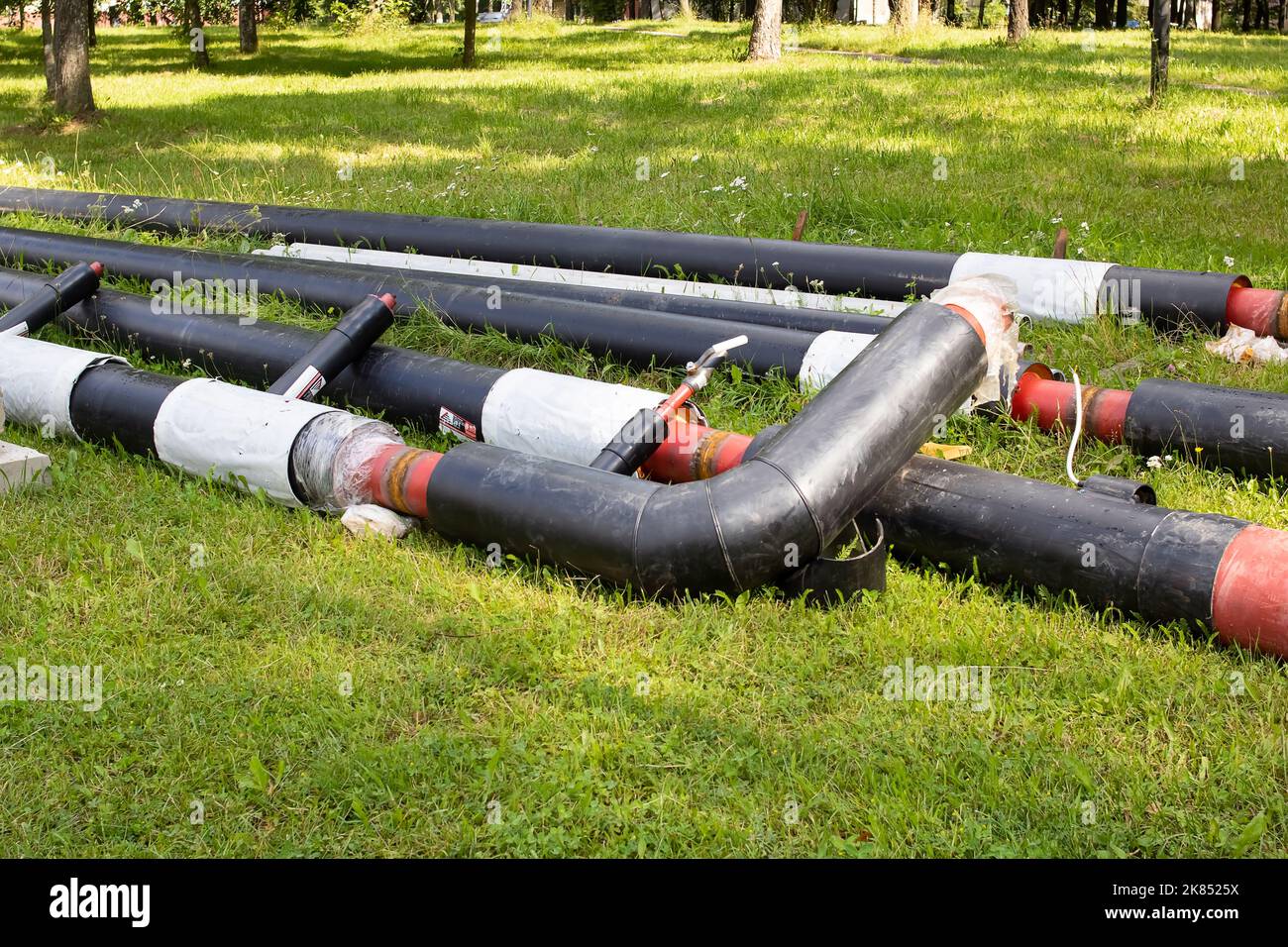 New pipes for water pipes with insulation on grass Stock Photo Alamy
