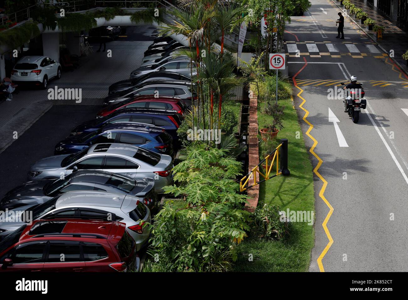 Cars for sale are parked at used car dealerships in Singapore October 17, 2022. REUTERS/Edgar Su Stock Photo