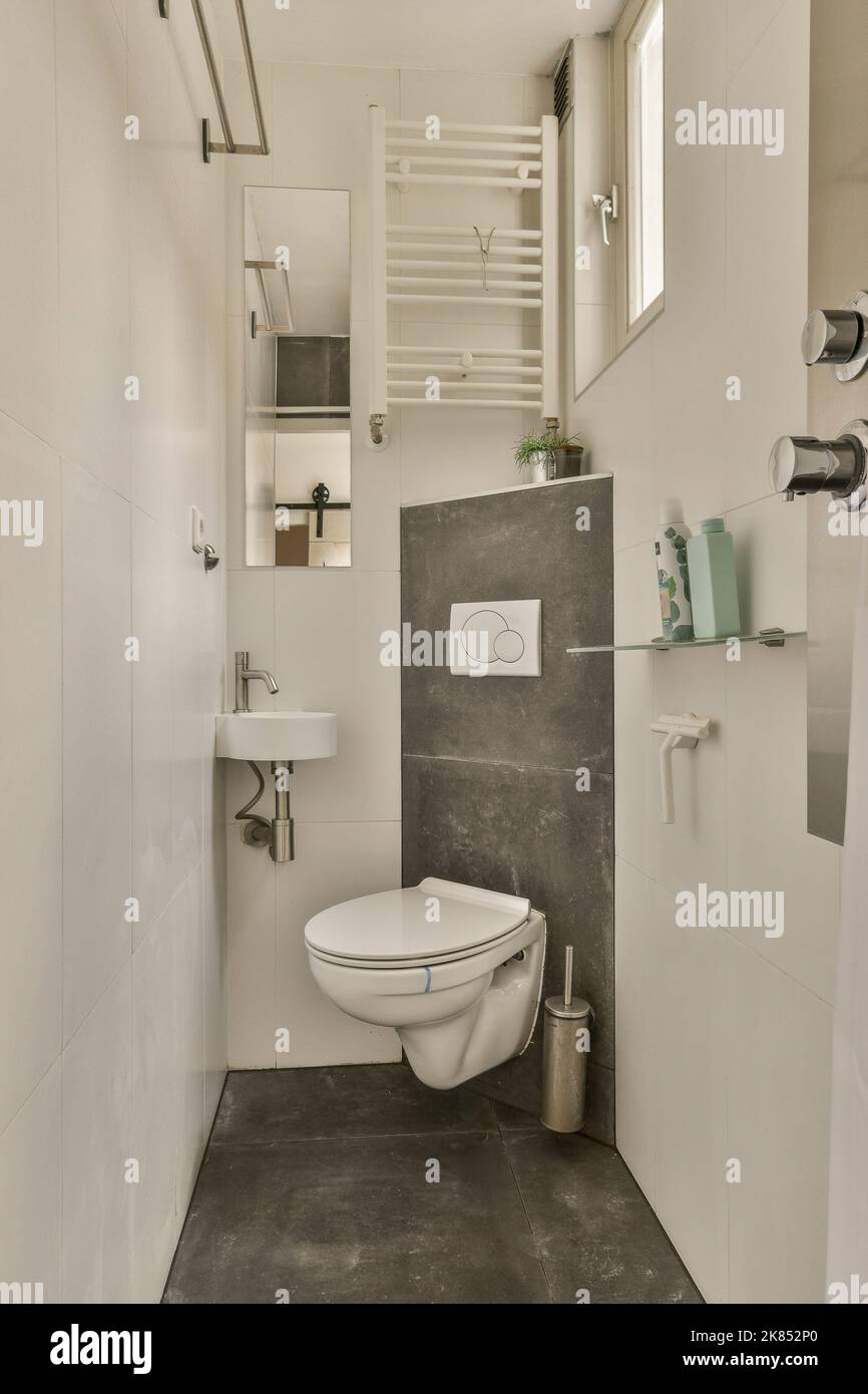 Interior of contemporary bathroom with shower and toilet in minimal
