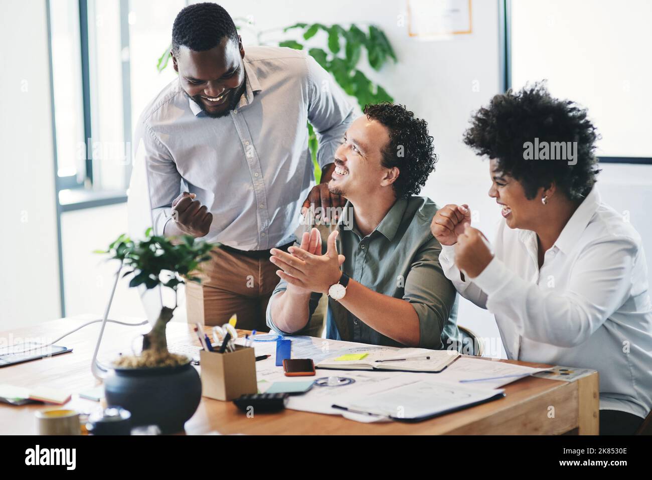 You can get anything done in a team. a group of young businesspeople ...