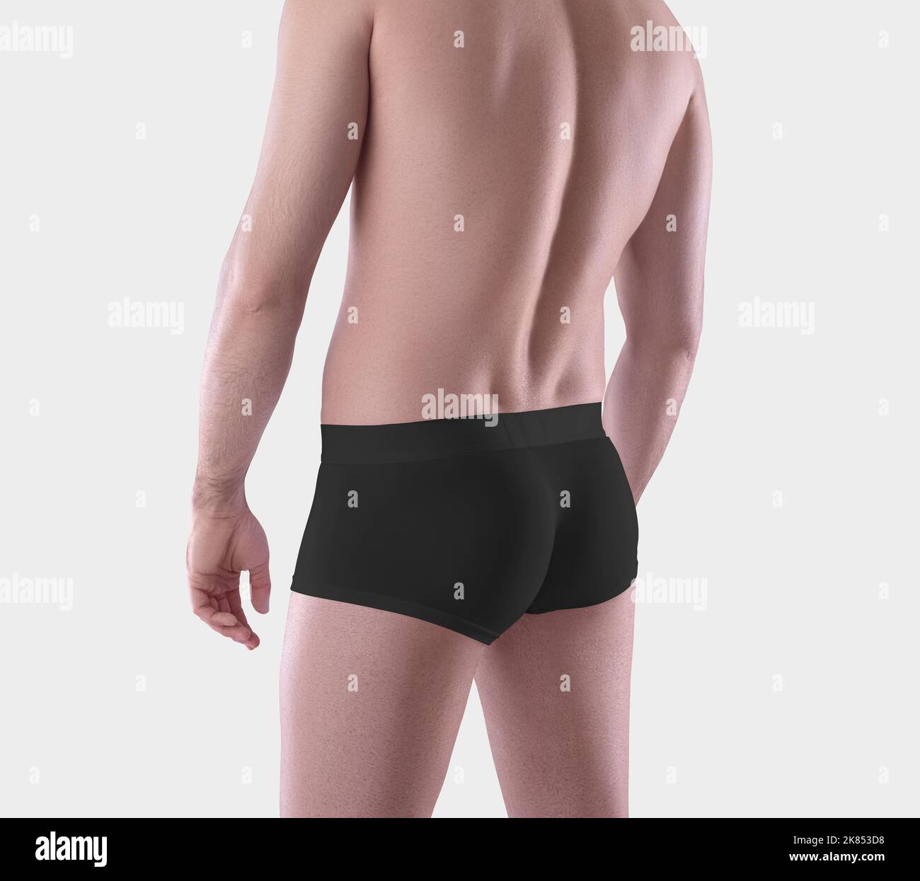 Mockup of black male boxers on the athletic body of a guy, brief underwear, isolated on background. Template of fashionable comfortable trunks, underp Stock Photo