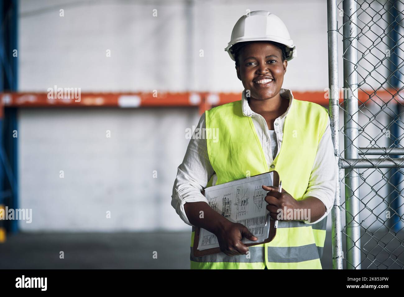 Get your helmet on, weve got hard work to do. Portrait of a confident young woman working a construction site. Stock Photo