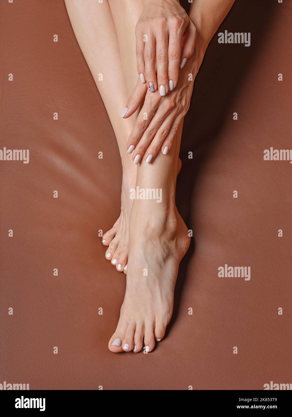 Overhead view of beautiful feet of middle age woman. Concept of taking care for the skin of the feet. Stock Photo