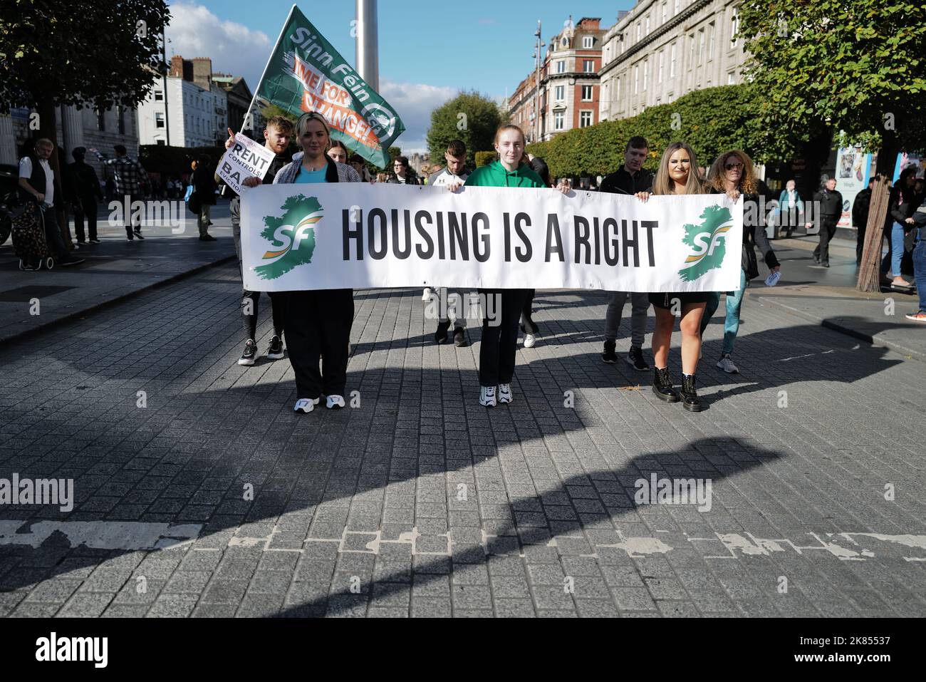 Three young Sinn Féin protestors demand a better housing situation at a Cost of Living Protest in Dublin city centre Stock Photo