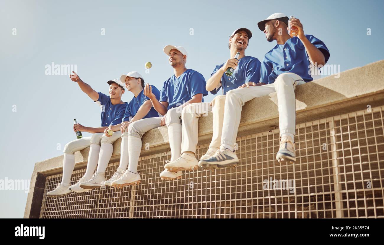 Baseball, team and baseball player, sports men together and health with fitness, diversity and group on a break. Young, athlete and happy, fruit and Stock Photo