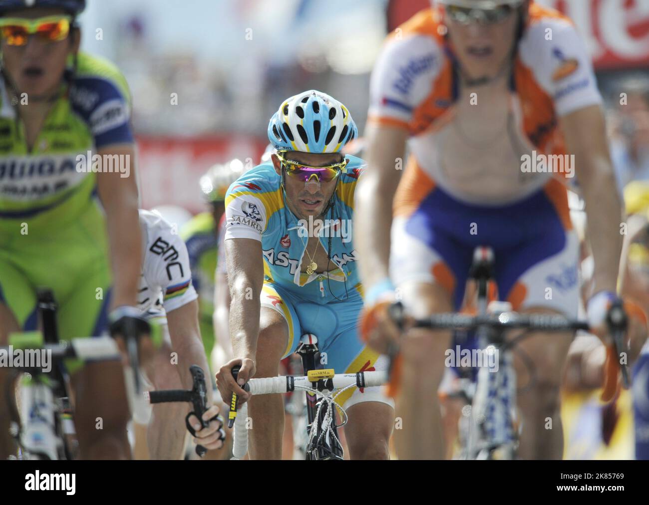 Astana's Alberto Contador (C) finishes in 3rd place in stage eight ...