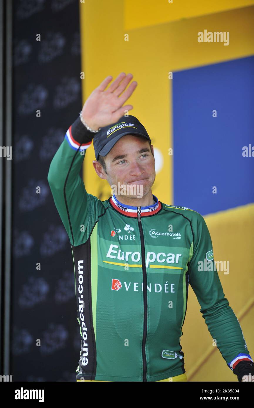 Team Europcar's Thomas Voeckler celebrates after finishing in 28th position  to retain the Yellow Leader's Jersey Stock Photo - Alamy