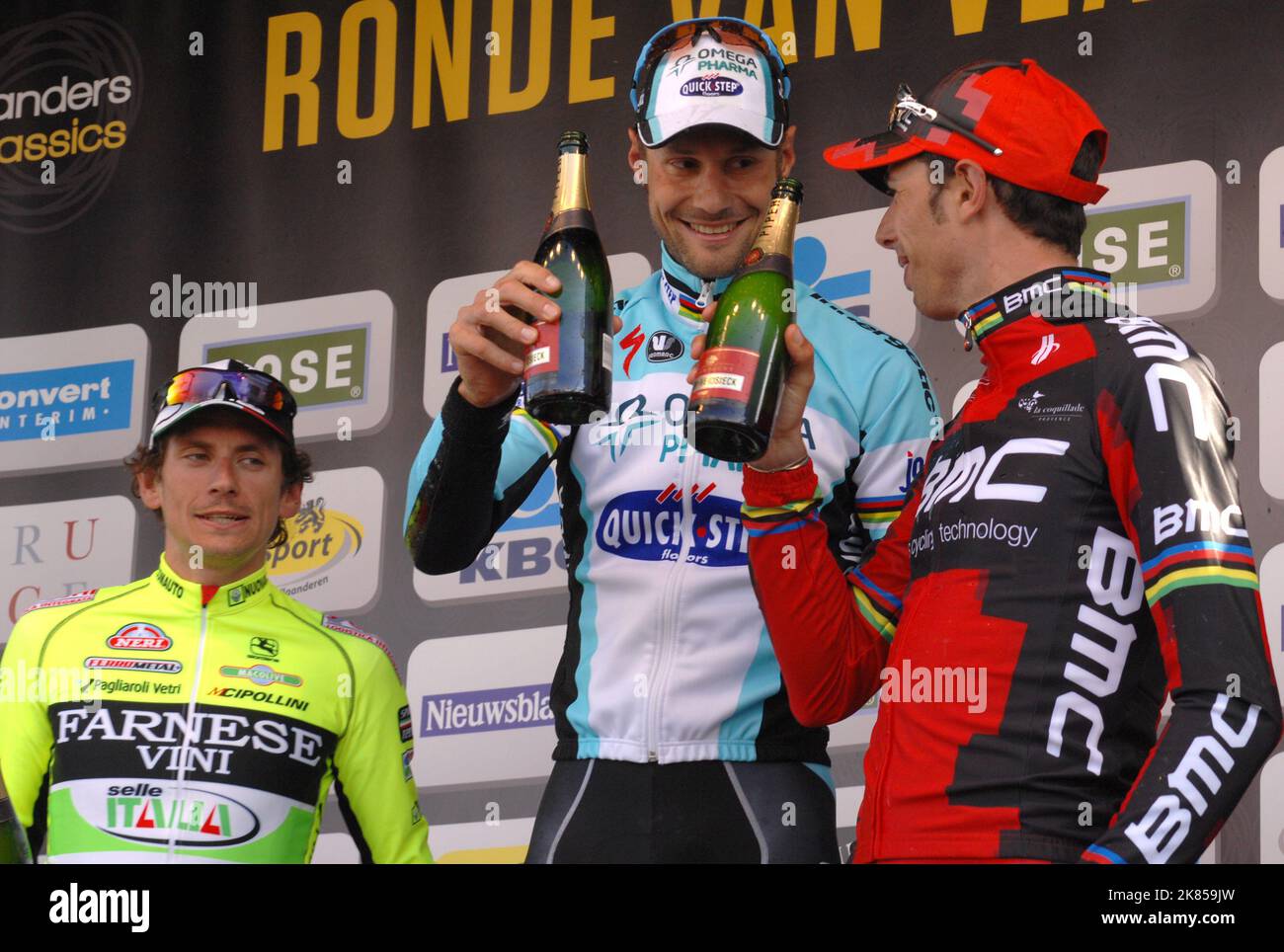 Tom Boonen of Team Omega Pharma - Quickstep stands on the podium after winning the 2012 Tour of Flanders (Ronde Van Vlaanderen) in Oudenaarde, Belgium ahead of Fillipo Pozatto of Team Farnese Vini - Selle Italia and Alessandro Ballan of BMC racing team Stock Photo