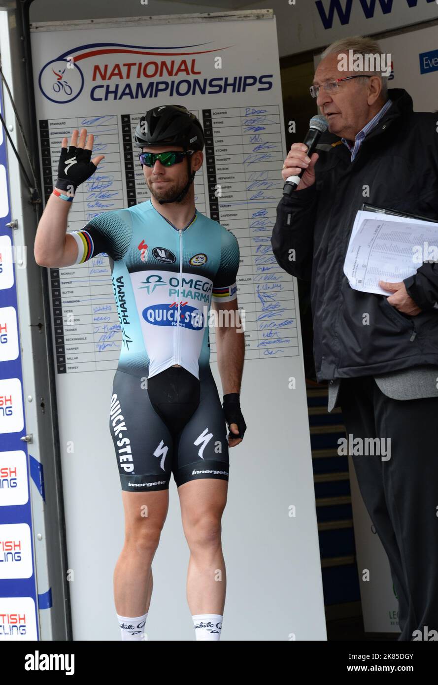 Mark Cavendish steps on to the podium after winning the National Road