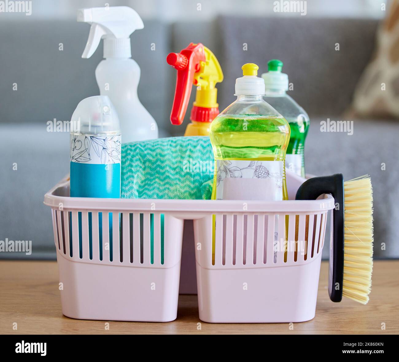 Cleaning supplies, brush and basket tools on table in home living room
