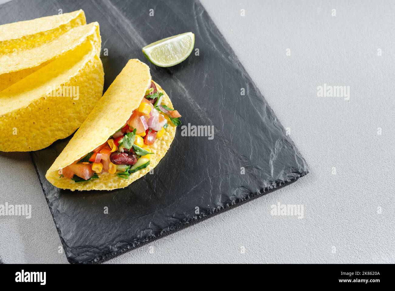 Homemade vegan tacos with black beans, sweet potato and guacamole and