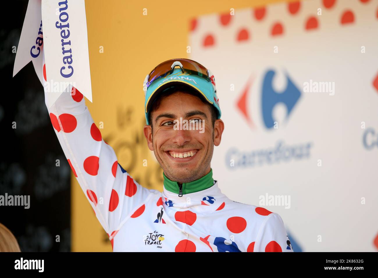 Italia's Fabio Aru (Astana) on the podium celebrating climbing into the Polka Dot Climbers jersey Stock Photo