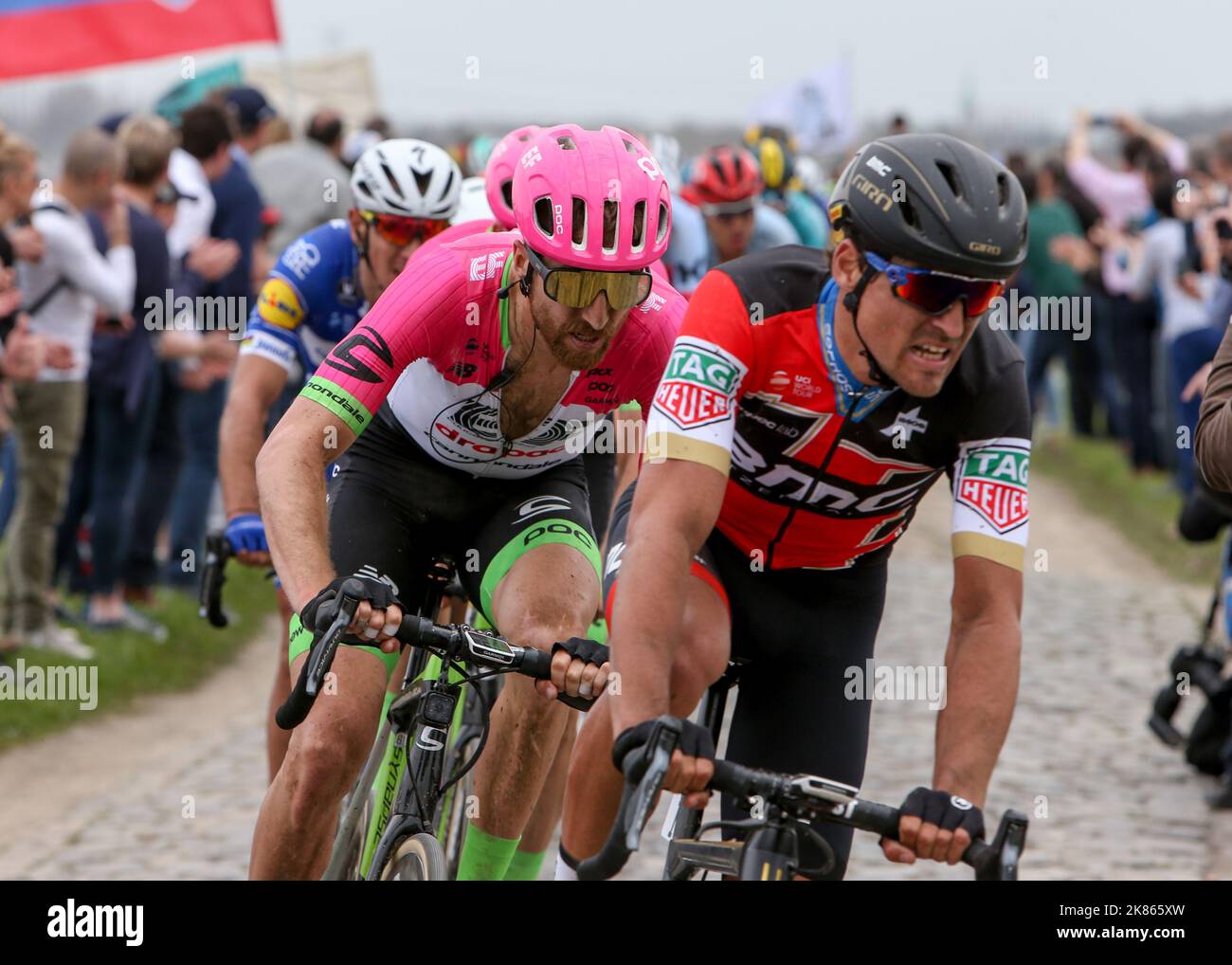 Greg Van Avermaet (BMC racing Team) leads Taylor Phinney ( EF Education First Drapac)  out of the BersŽe PavŽ sector Stock Photo