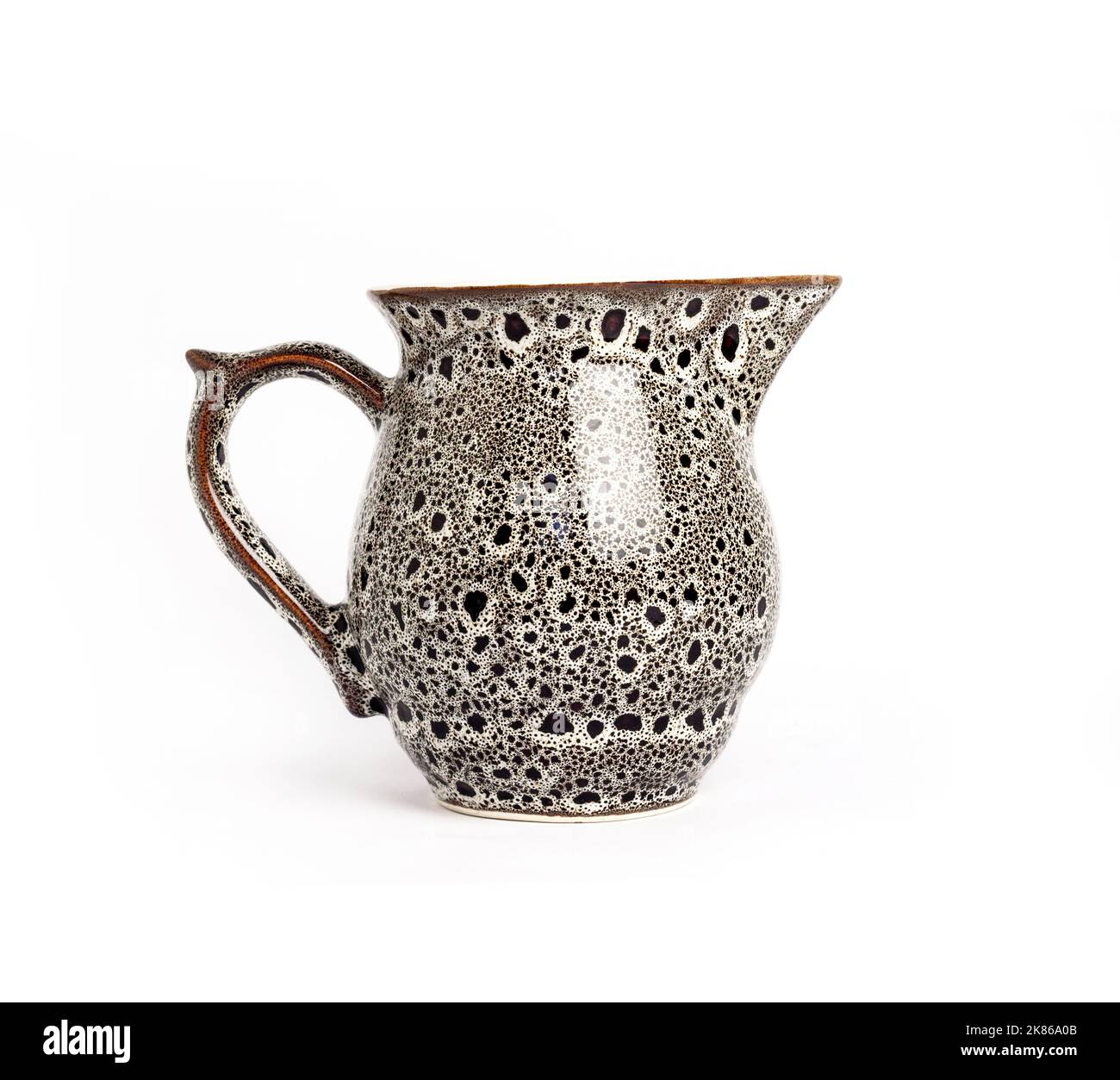 Glazed ceramic milk jar isolated on a white background Stock Photo