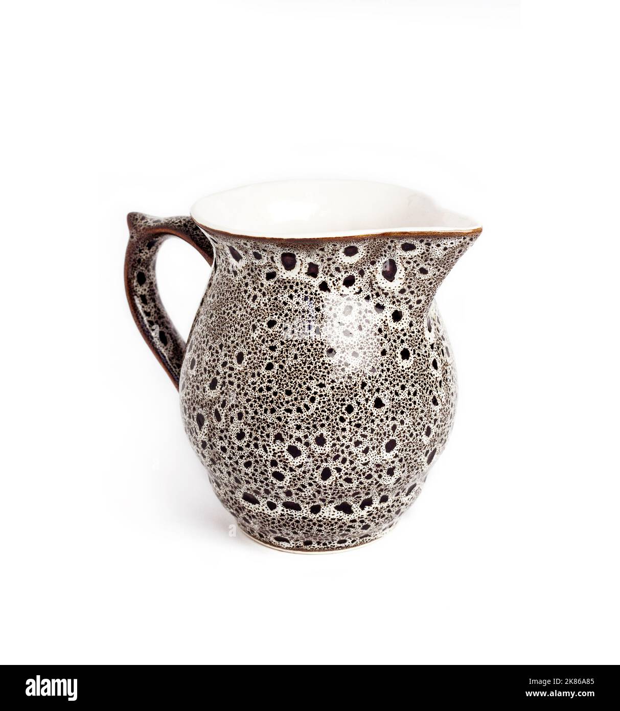 Glazed ceramic milk jar isolated on a white background Stock Photo