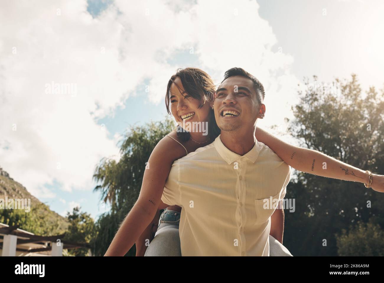 Man Giving Piggyback Ride To His Girlfriend Stock Photo - Image of  cheerful, person: 41022350