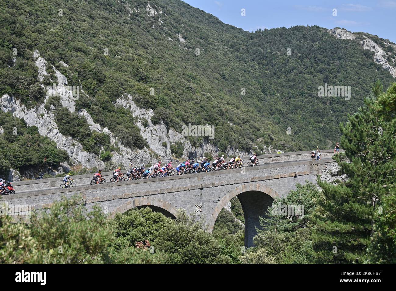 The peloton rides over a bridge during stage 14 of the Tour de France, Saturday 10th July, 2021. Photo credit should read:  David Stockman/GodingImages Stock Photo