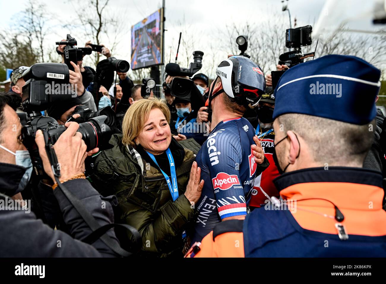 The 2022 Tour of Flanders from Antwerp (Antwerpen) to Oudenaarde. Mathieu Van Der Poel for team AlpecinFenix (NED) embraces his mother on the finish line after winning the stage. Stock Photo