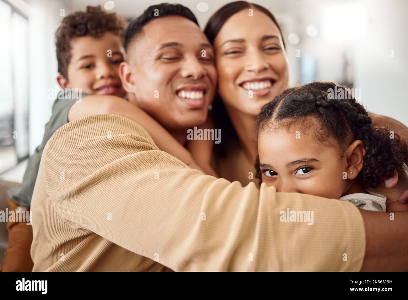 Love, family and hug portrait in living room with Mexican parents and ...