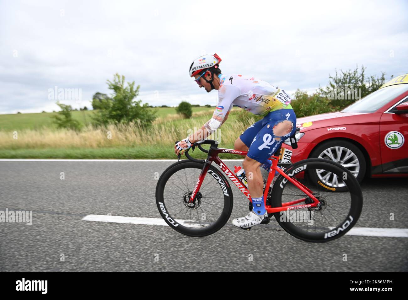 BURGAUDEAU Mathieu for team TotalEnergies rides at the back of the group with torn kit and cuts and bruises after falling in the early stages of the Tour de France 2022, Stage 6, Binche to Longwy Stock Photo