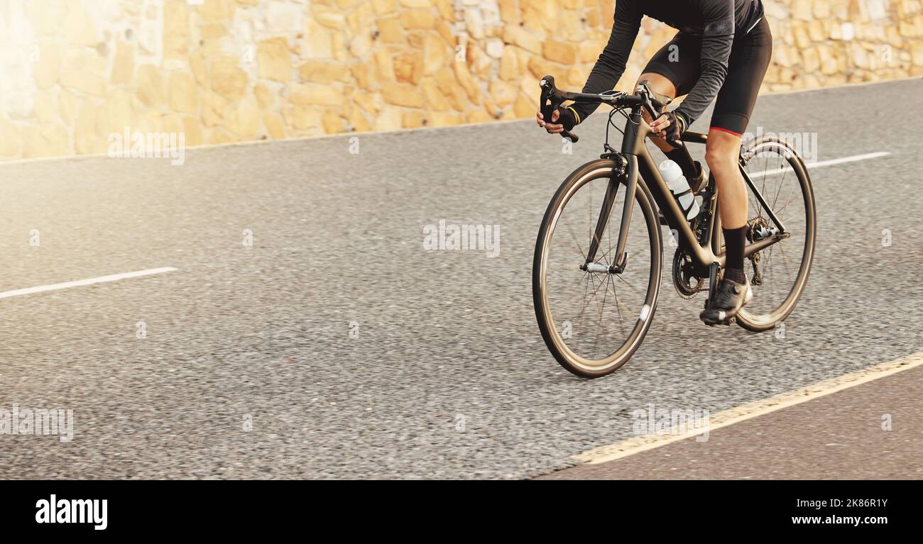 Road cycling, fitness and sports man marathon training, triathlon exercise and bike workout in