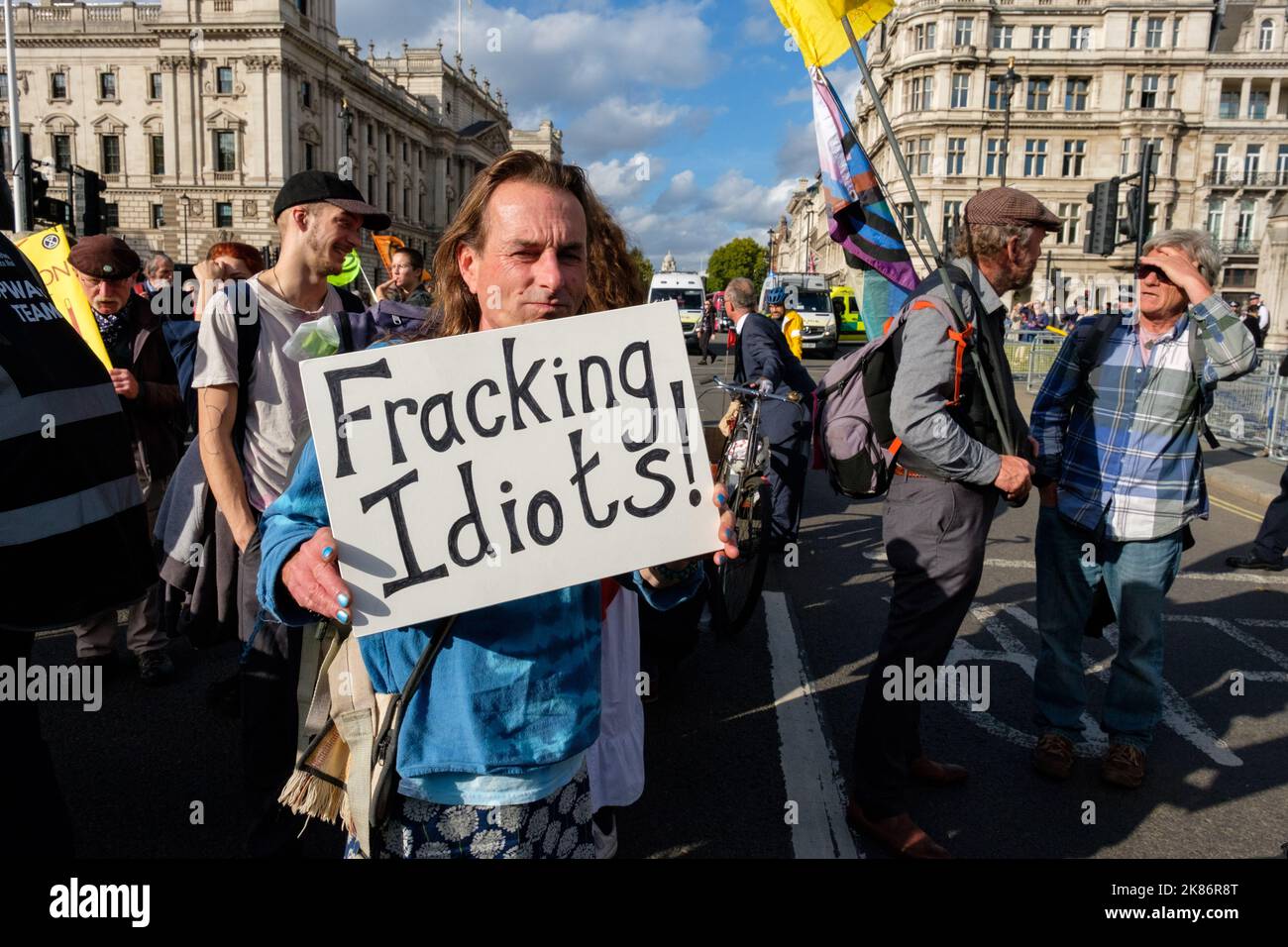 London, UK. 1 OCT, 2022. A person holds a sign against fracking. Climate activists from the Just Stop Oil coalition march after a Enough is Enough ral Stock Photo