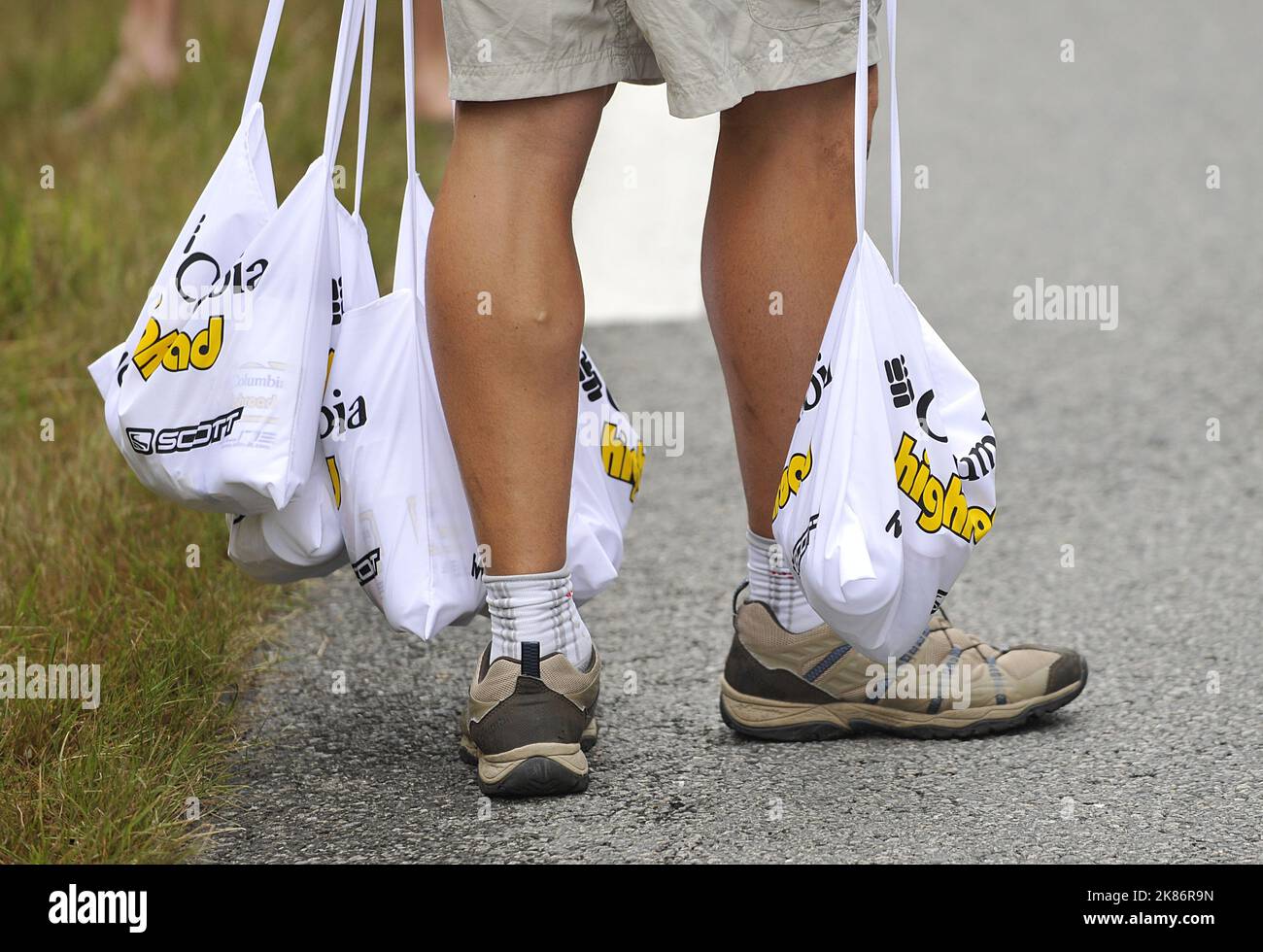 A memeber of Columbia-HTC holds food bags in his hands during the tenth stage of the Tour de France between Limoges and Issoudun Stock Photo