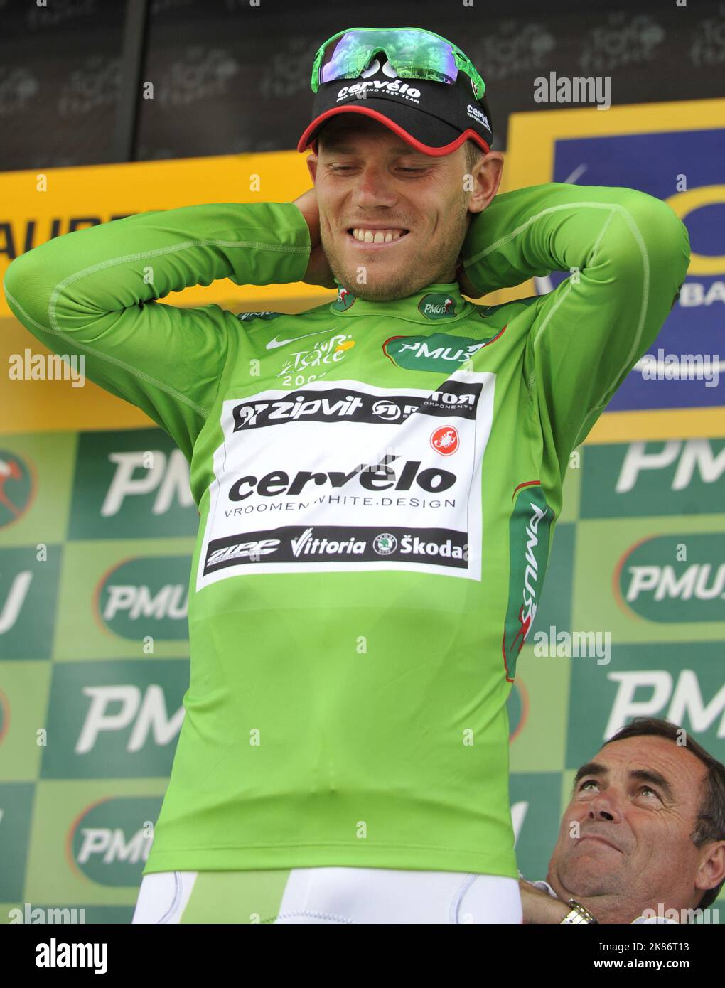 Thor Hishovd stands on the podium and receives the green points jersey Stock Photo