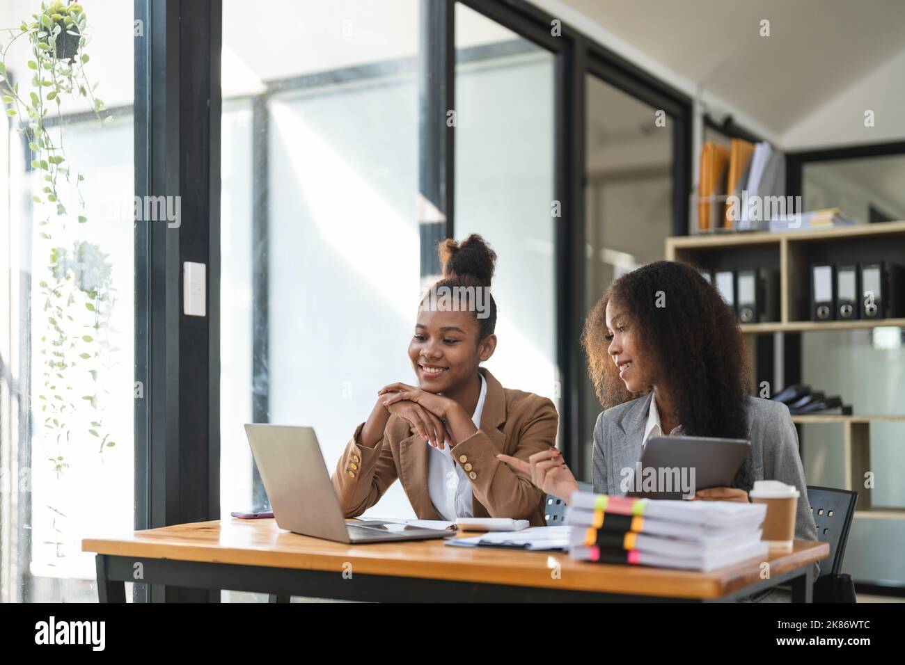 Two young business people working together in office. financial analysis accounting concept. Stock Photo