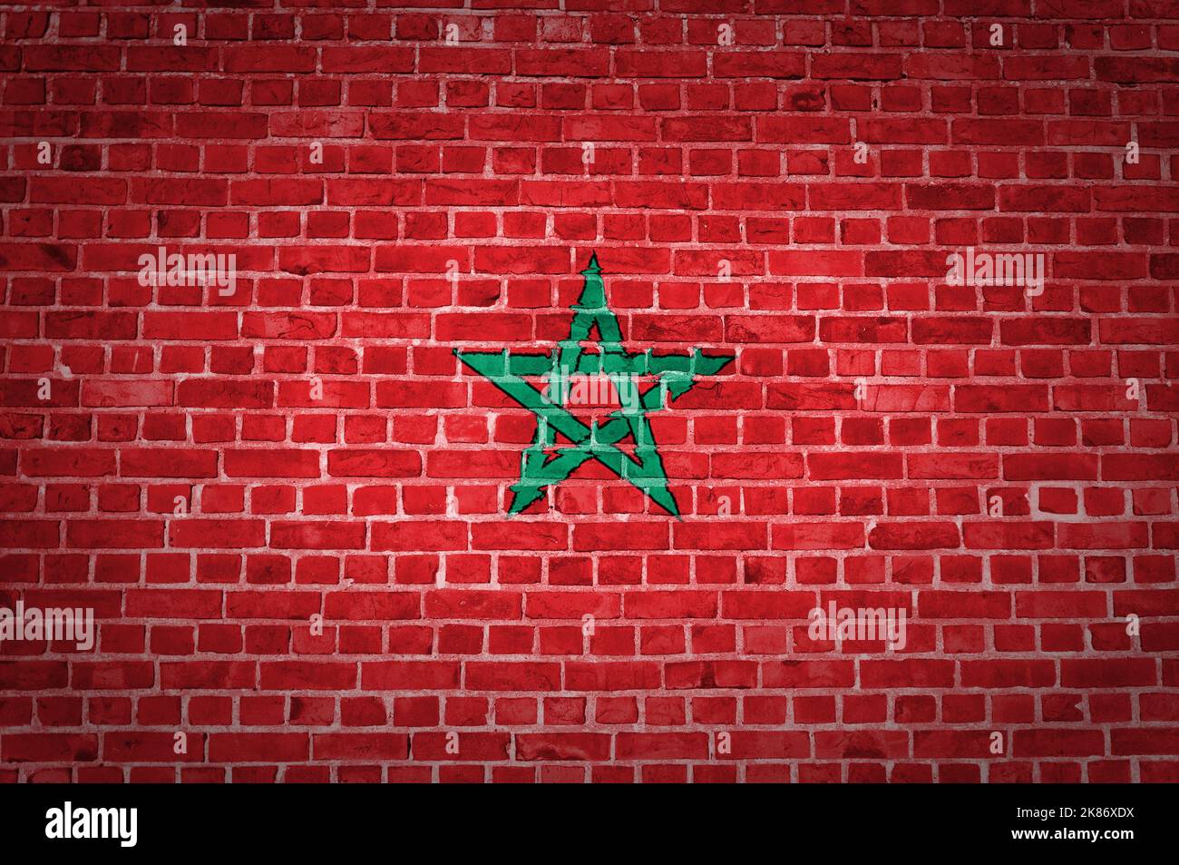 An image of the Morocco flag painted on a brick wall in an urban ...