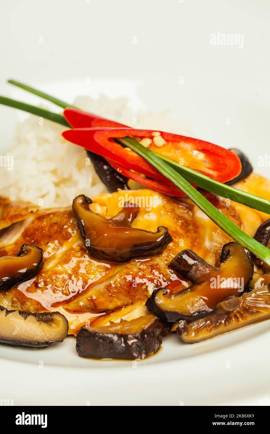 Mushroom shiitake with chicken in white bowl close up Stock Photo Alamy