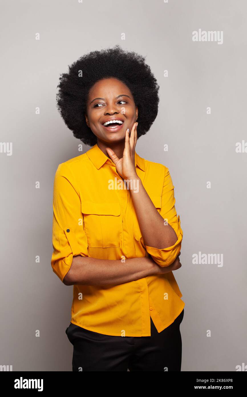 Woman in yellow shirt hi-res stock photography and images - Alamy