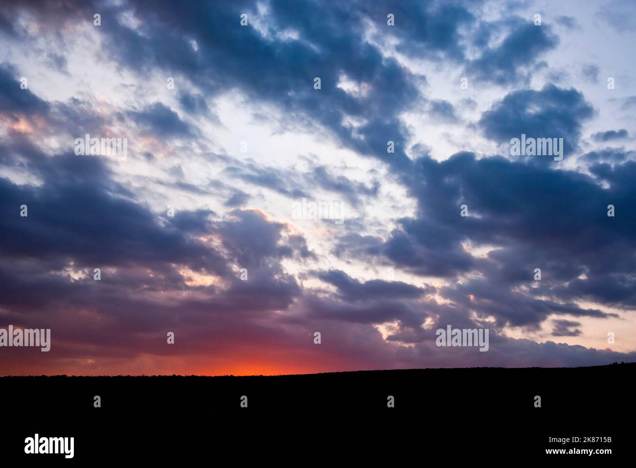 Sky with clouds at sunset Stock Photo - Alamy