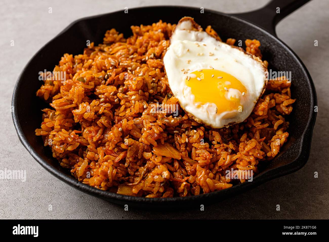 Korean fried rice. Fried rice with kimchi. Spicy rice dish Stock Photo