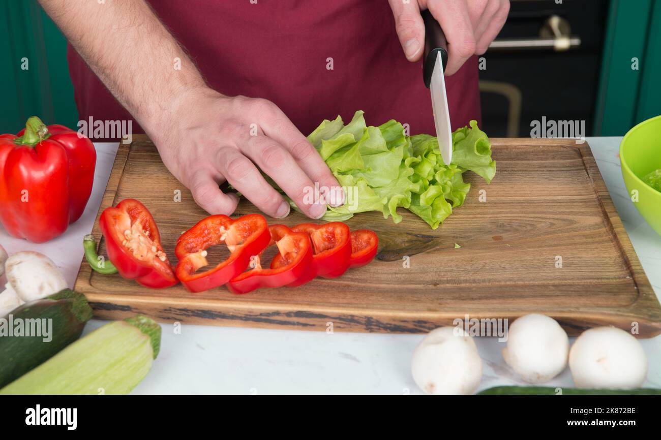 https://c8.alamy.com/comp/2K872BE/be-careful-with-knife-chef-teaches-how-quickly-chop-vegetables-chop-food-safely-and-efficiently-ensure-that-you-use-the-right-tools-learn-how-hold-2K872BE.jpg