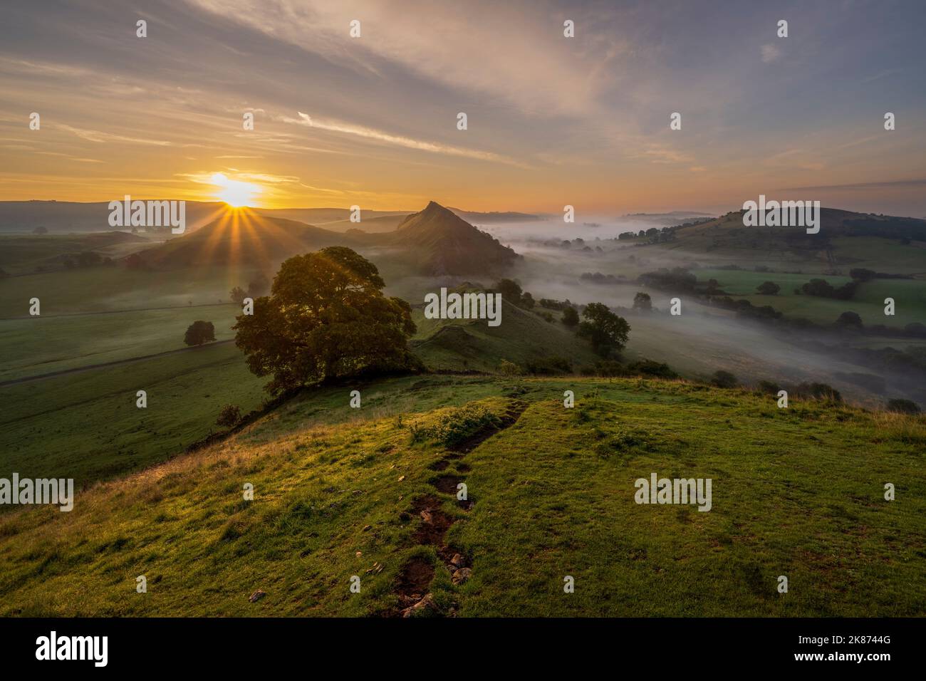 Sunrise at Chrome Hill and Parkhouse hill with low lying cloud in The Peak District, Derbyshire, England, United Kingdom, Europe Stock Photo