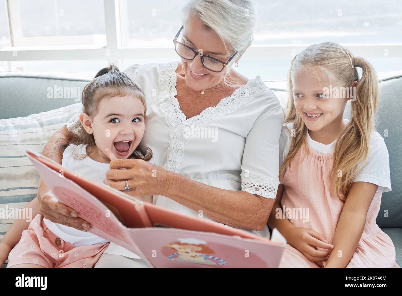 Grandmother, Children And Reading Books On Living Room Sofa In Family ...