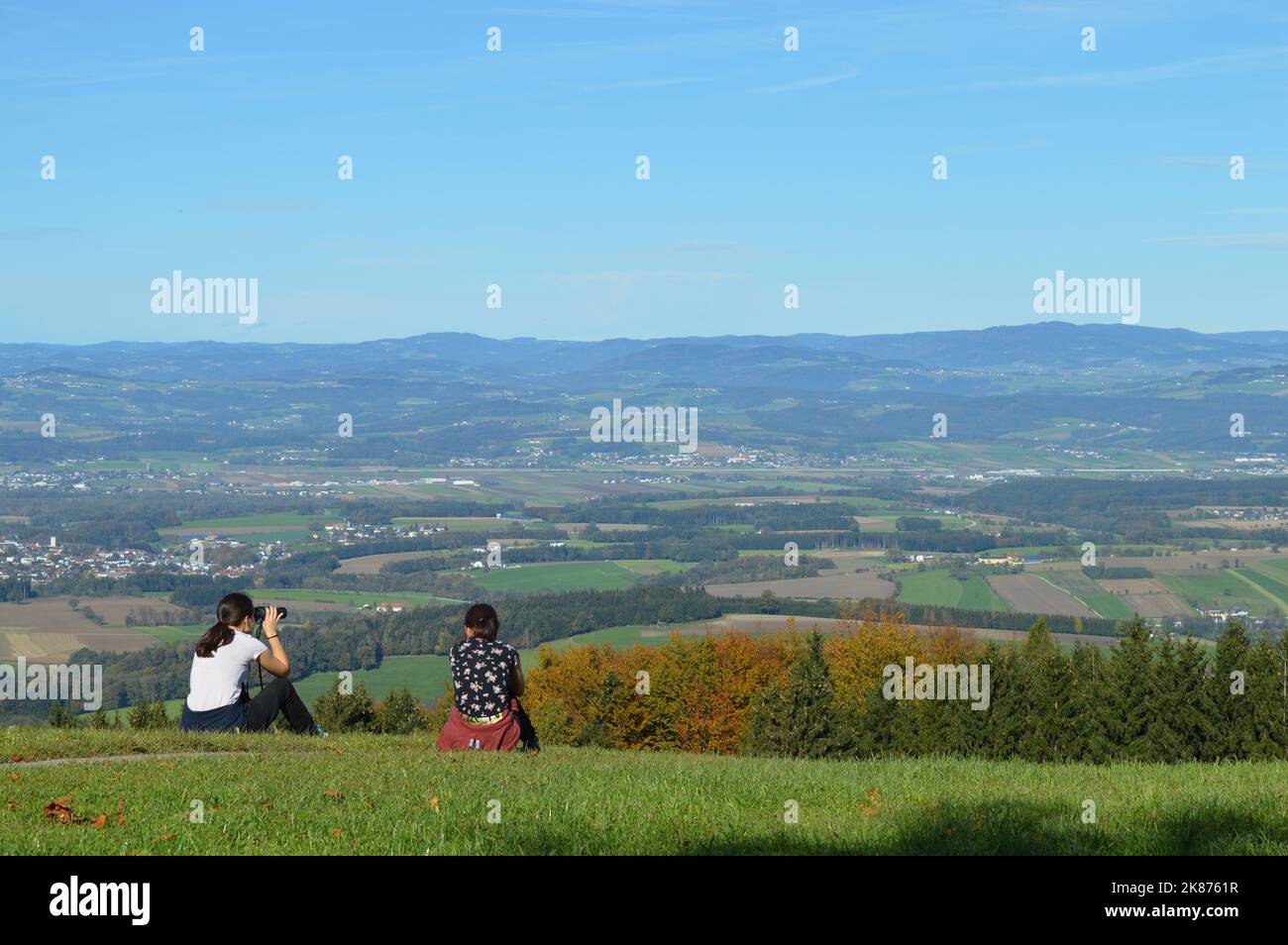 Two girls enjoy panorama view on Amstetten region Stock Photo