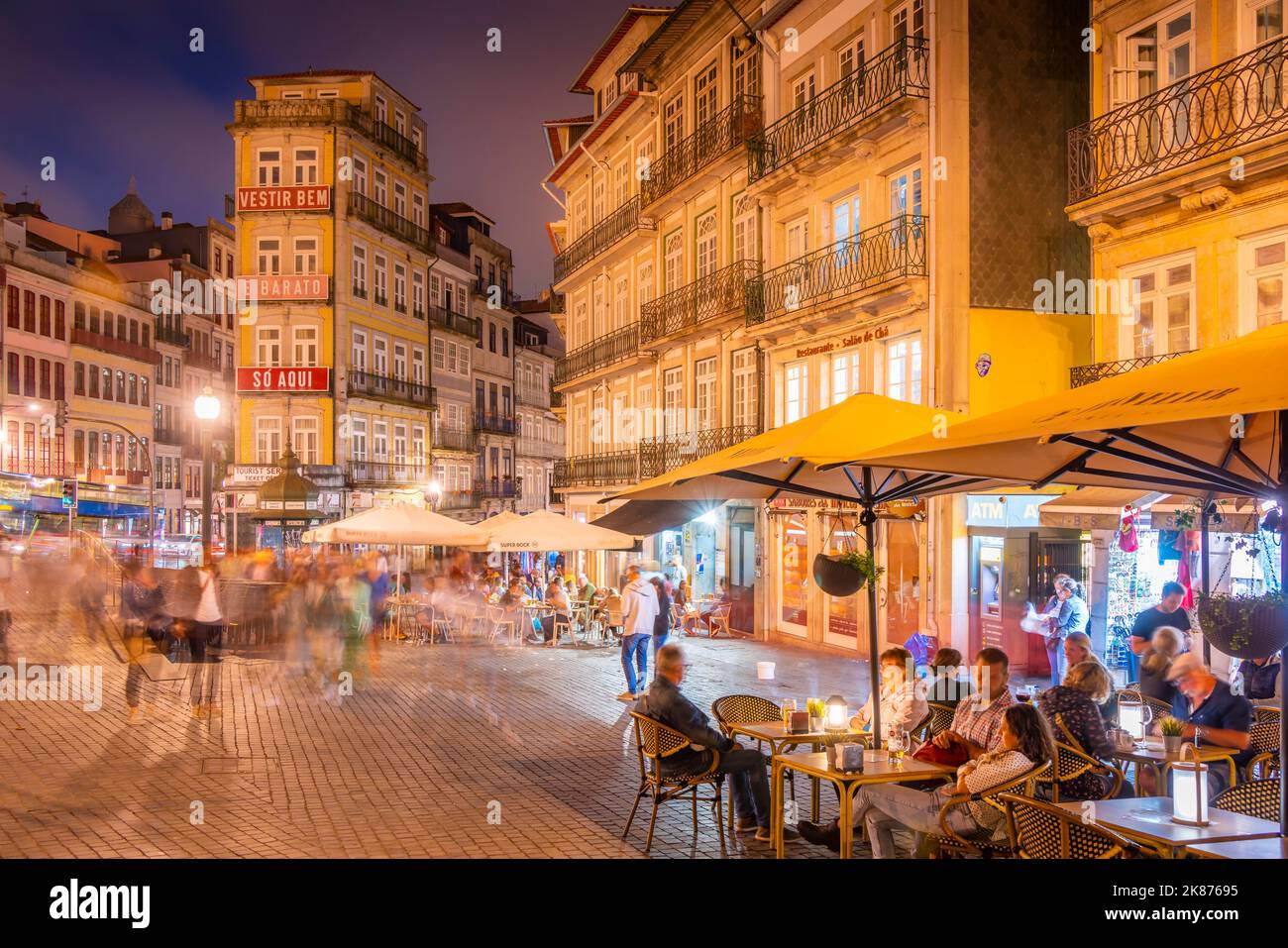 View of cafes in Praca de Almeida Garrett at night, Porto, Norte, Portugal, Europe Stock Photo