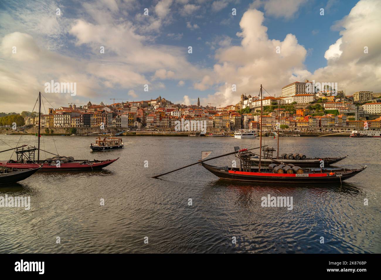 View of the Douro River and Rabelo boats aligned with colourful buildings, Porto, Norte, Portugal, Europe Stock Photo